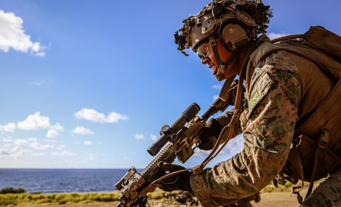 U.S. Marine Corps Lance Cpl. Kobe Manning, a team leader assigned to Charlie Company, Battalion Landing Team 1/5, 15th Marine Expeditionary Unit, bounds to cover while engaging simulated enemy targets during live-fire squad attacks at Marine Corps Base Hawaii July 18, 2024. Squad level live-fire training enhances combat readiness and maintains the proficiency of the Marine Corps rifle squad. (U.S. Marine Corps photo by Cpl. Aidan Hekker)